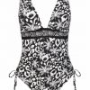 Bañador de mujer con lazos laterales, escote en V y estampado animal print en blanco y negro - Fotografía de catálogo sin modelo - Ana Faura